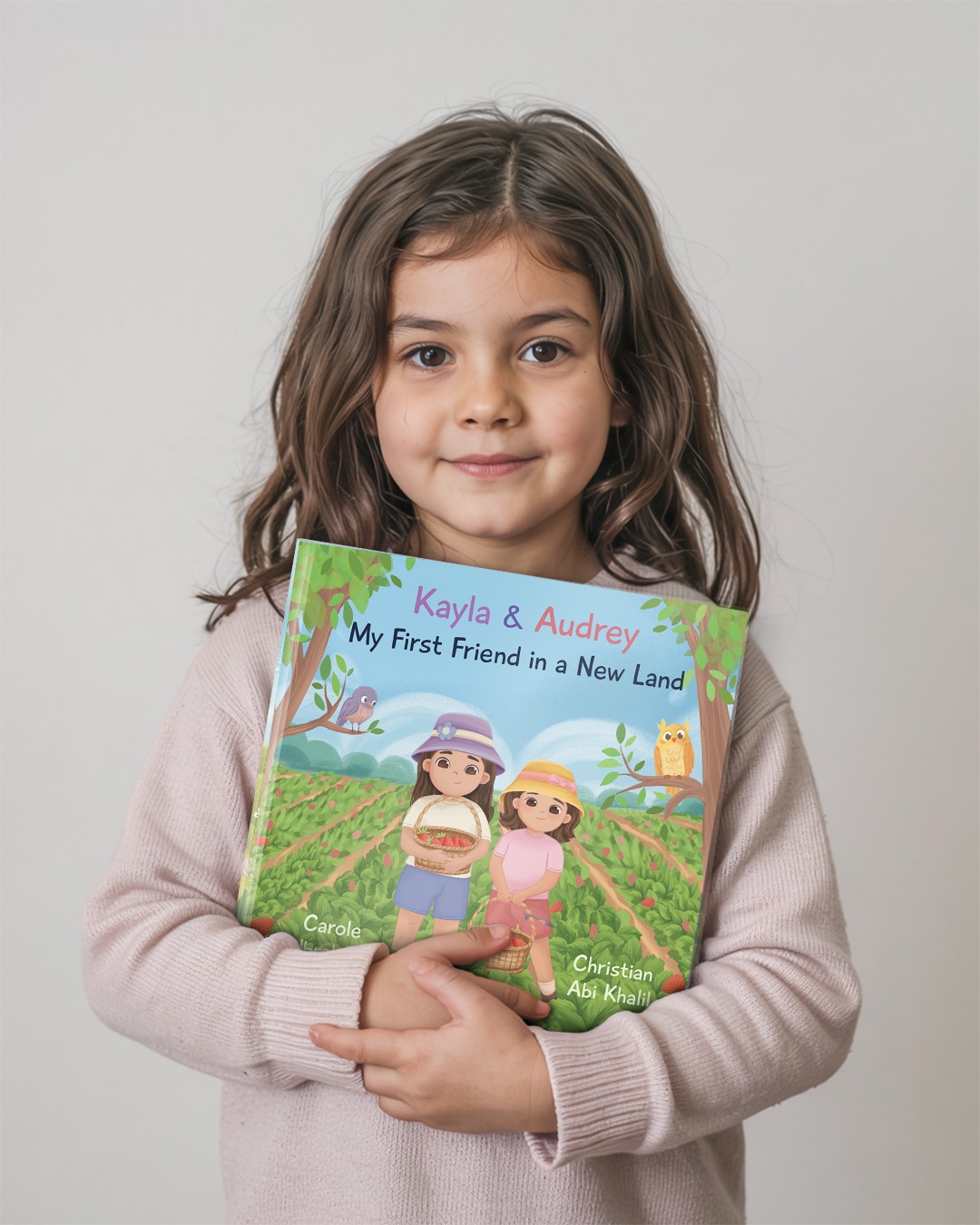 Young reader holding My First Friend in a New Land